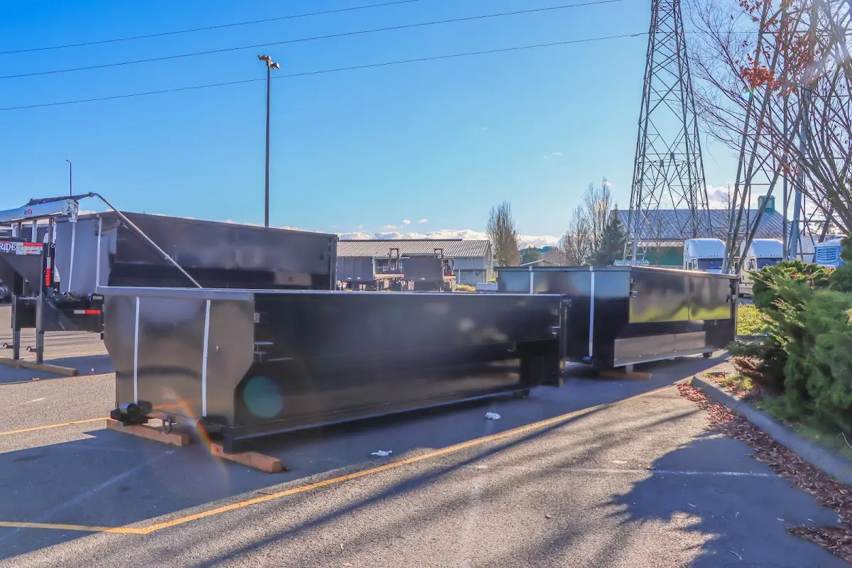 Roll-off dumpster ready for waste disposal at job site for 2 Yard Dumpster Rental in Corinth